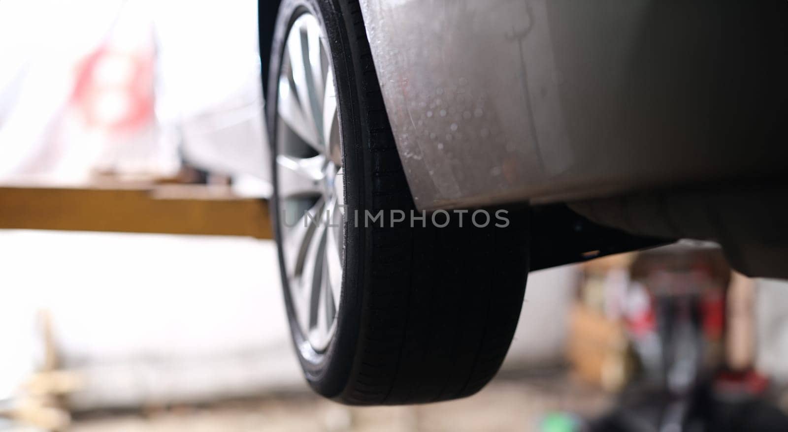 Closeup of rubber tires on car wheel. Auto tire service concept