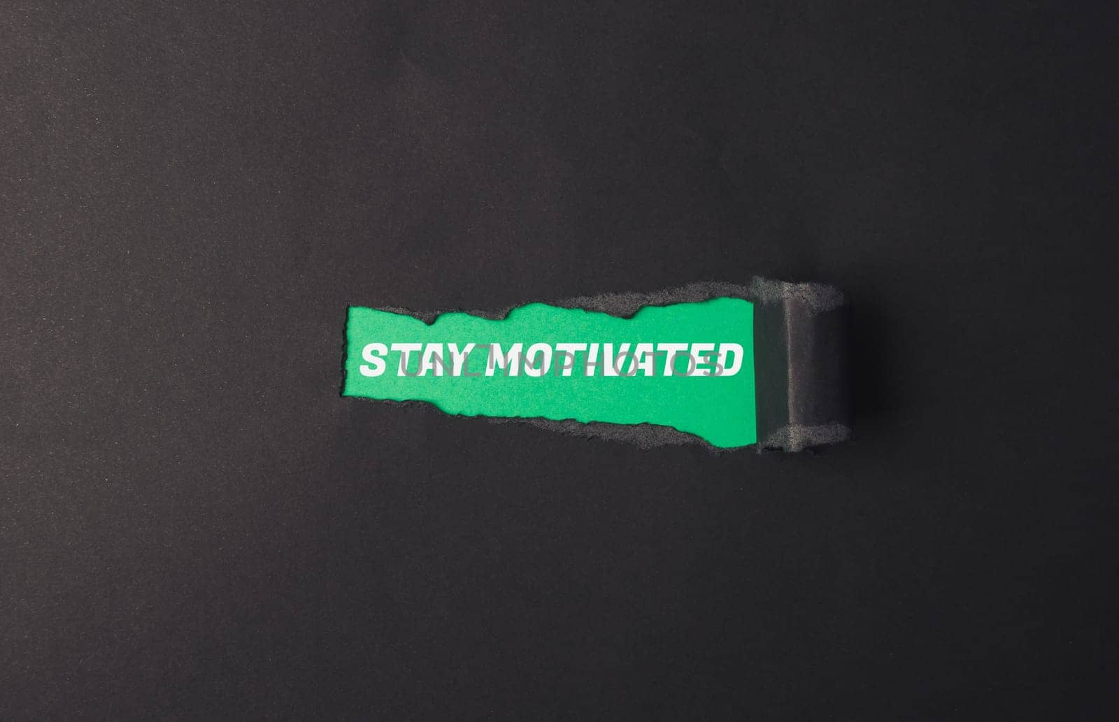 A green sign that says Stay Motivated by Alla_Morozova93