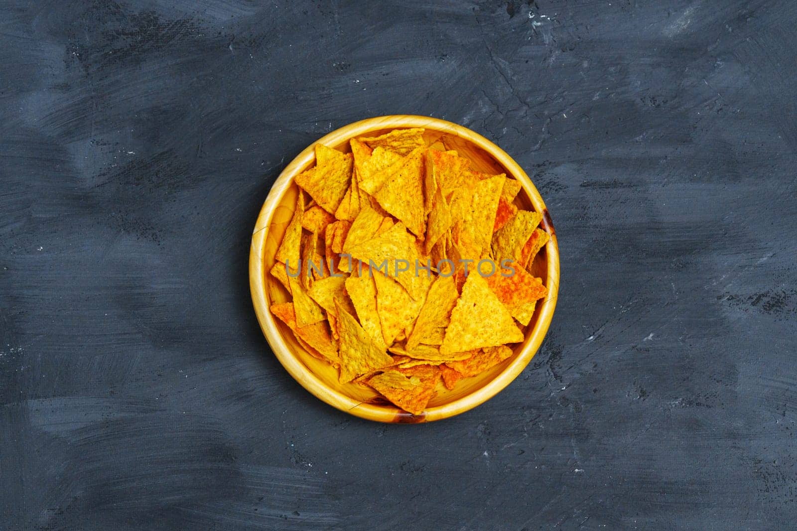 Yellow Bowl Filled With Tortilla Chips. Flat lay by darksoul72