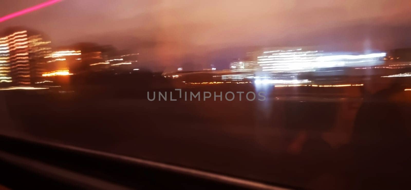 Conceptual shot of the light trails captured from the window of the moving train