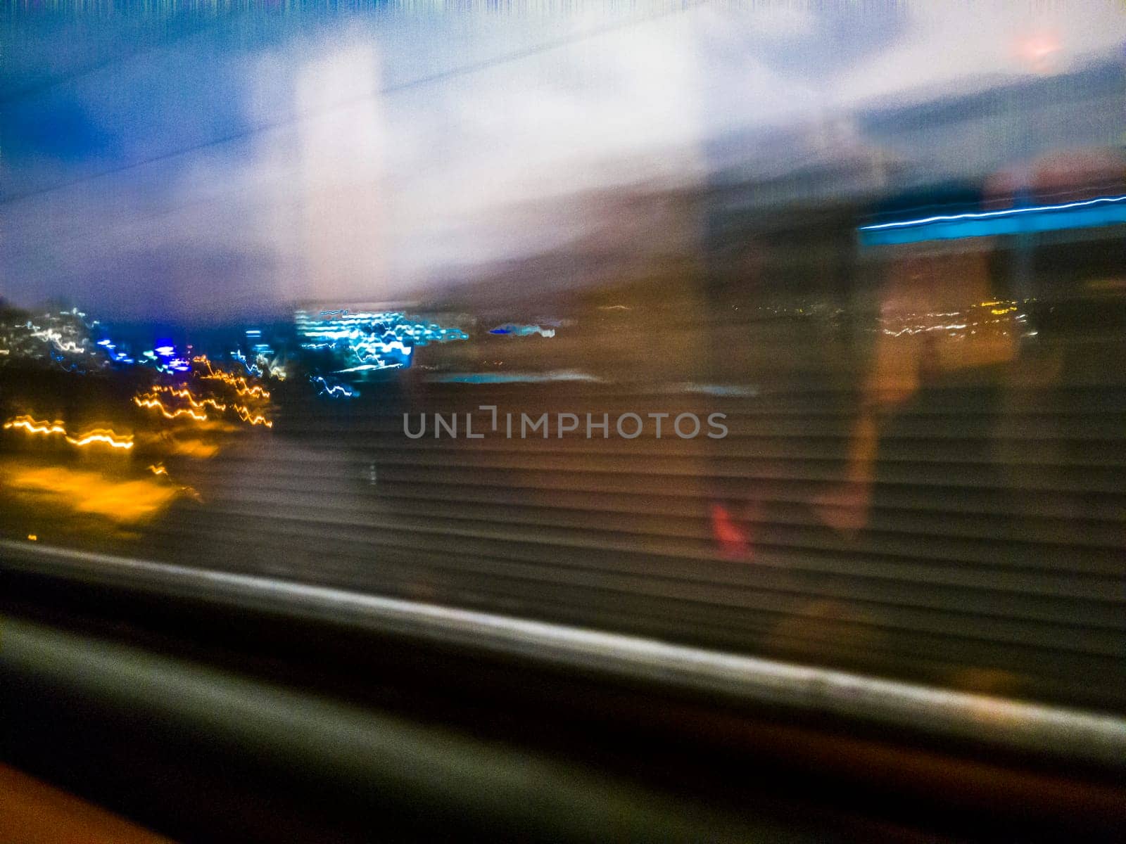 Conceptual shot of the light trails captured from the window of the moving train