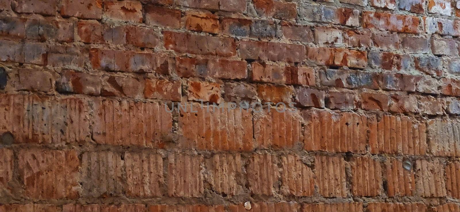 Close up shot of the wall made of old bricks