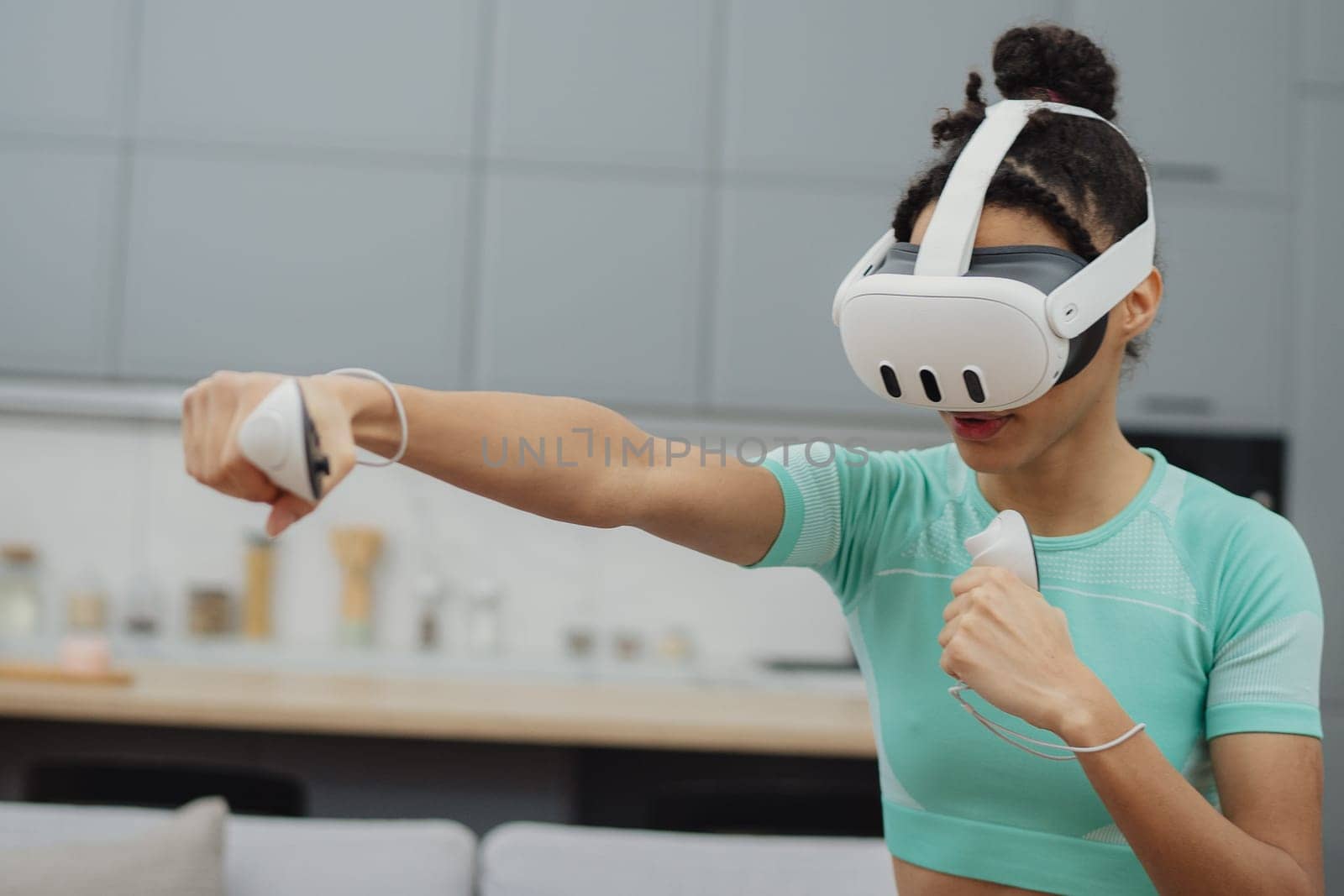 Training to become the best. Beautiful young woman in sports clothing exercising at home.