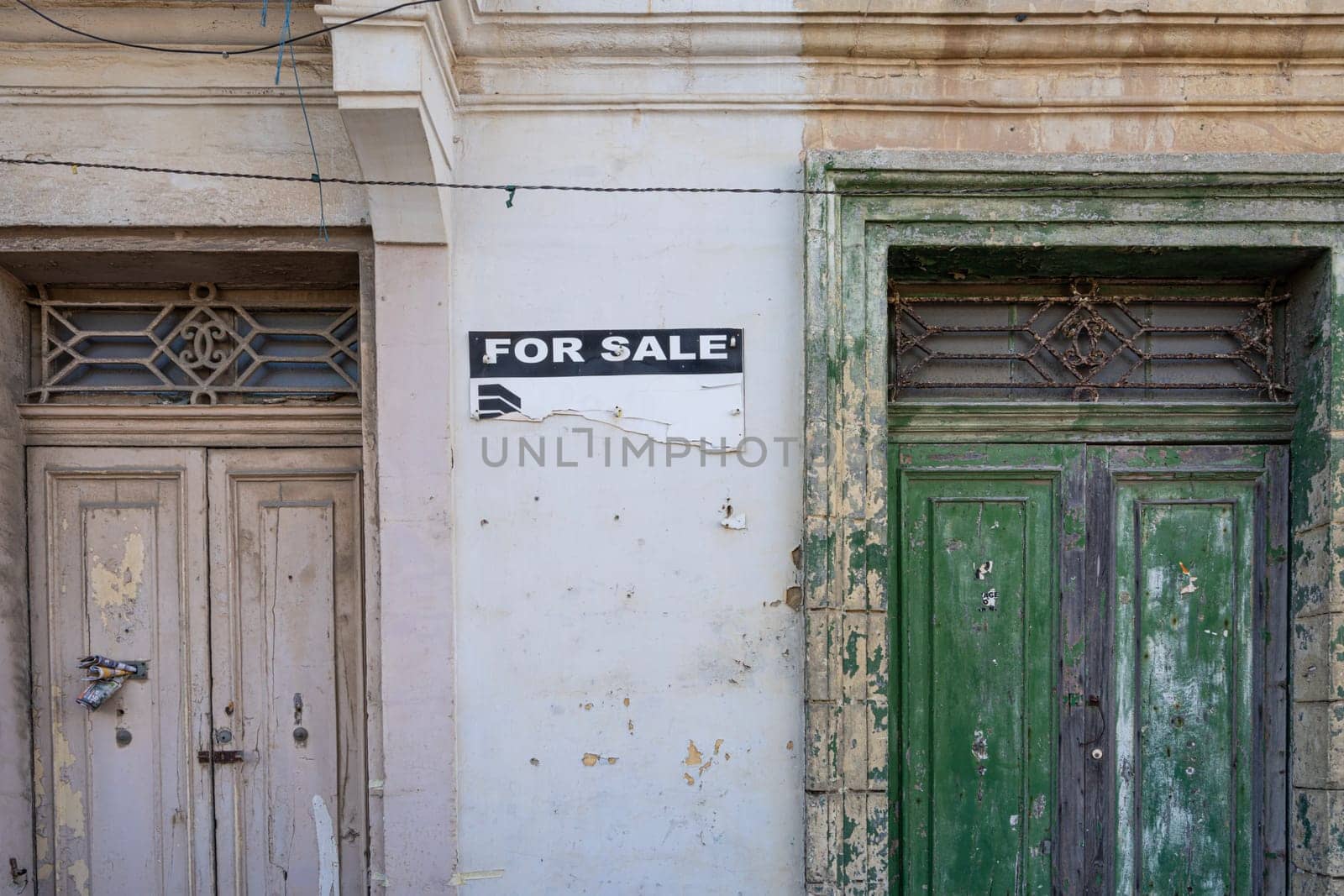 Valletta, Malta, April 03, 2024 the sign with the words For Sale in a dilapidated building in the historic center of the city