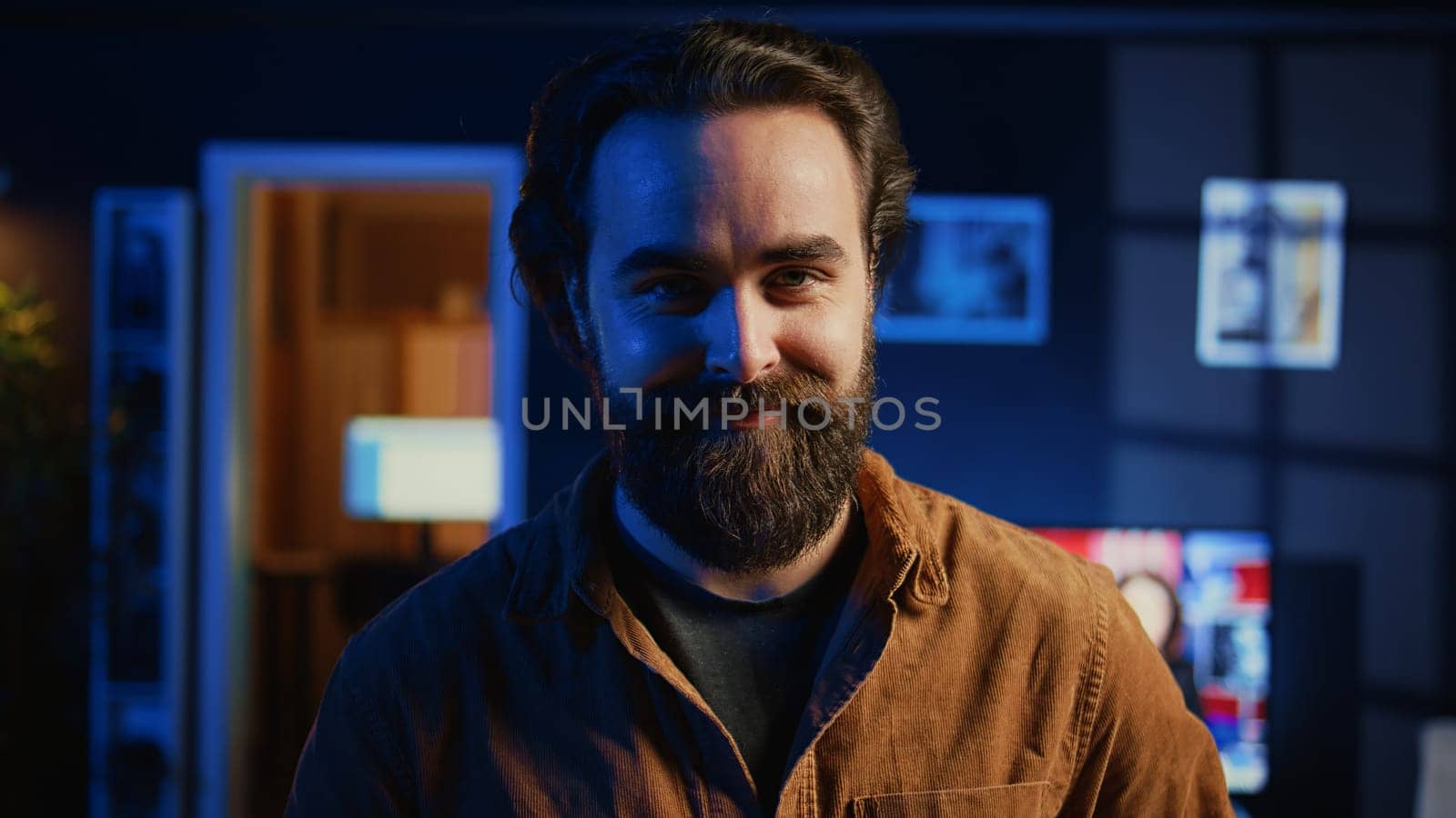 Portrait of smiling developer writing complex binary code scripts on laptop terminal. Cheerful remote IT employee standing in home office, using programming to safeguard consumer data, camera B