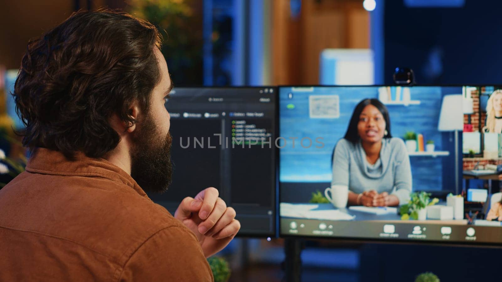 Teleworking software engineer talking with colleagues during internet videocall, discussing ways to fix programming bugs. IT admin in videoconference meeting with coworkers, camera A