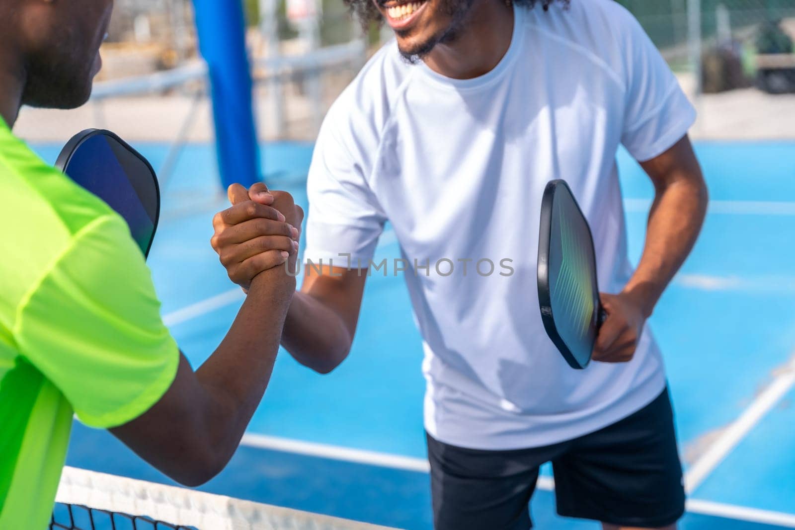 Pickleball rivals shaking hands before playing a match by Huizi
