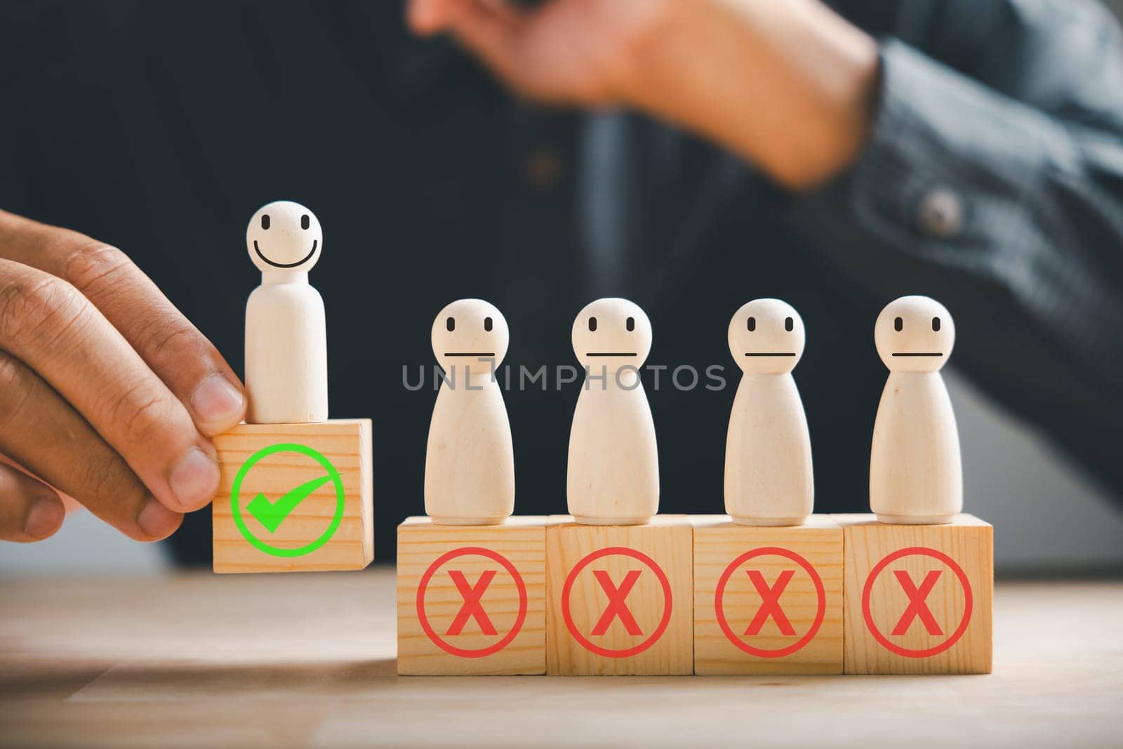 Hand of a businessman touches wooden cube with a check mark symbolizing employment choice. Illustrates business service rating and satisfaction concept. Think With Yes Or No Choice.