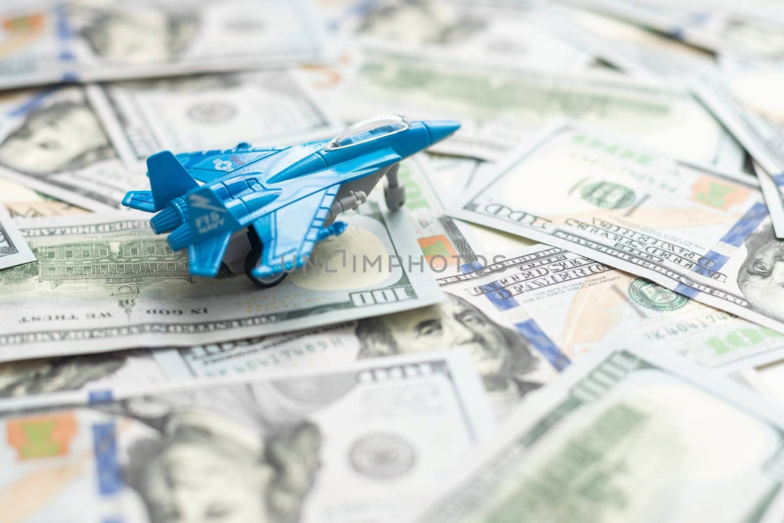 Military toy airplane jet aircraft - on money background. High quality photo