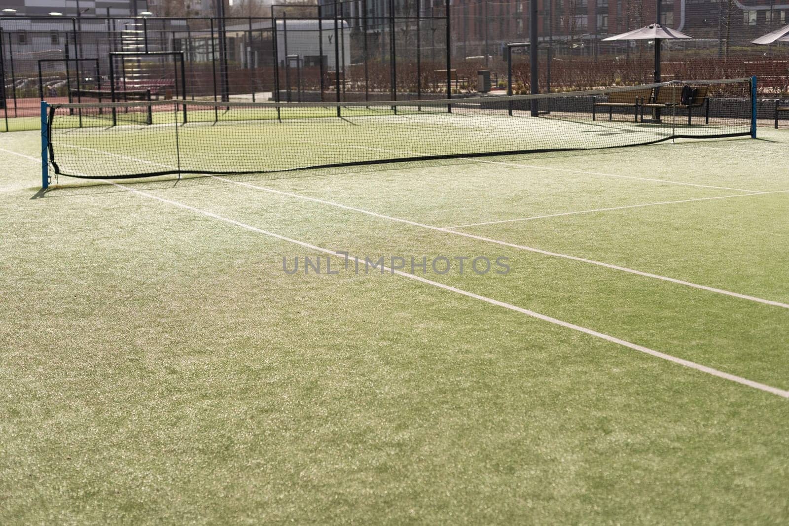 View of multi-functional sports area with tennis courts. High quality photo