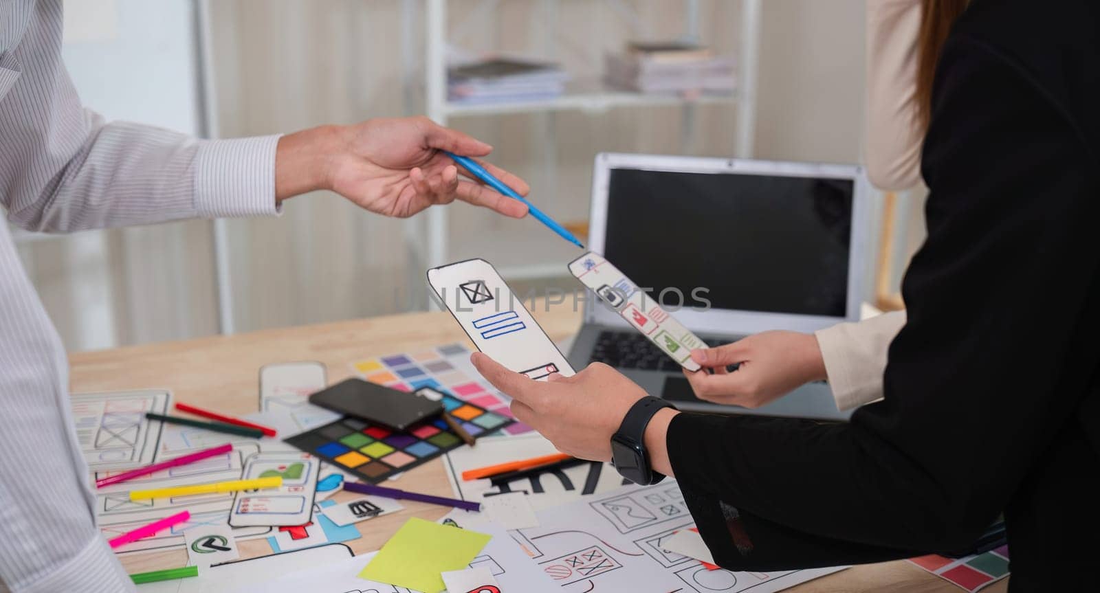 Close up, Making ux ui application design work plan of modern business team brainstorming together in conference room.