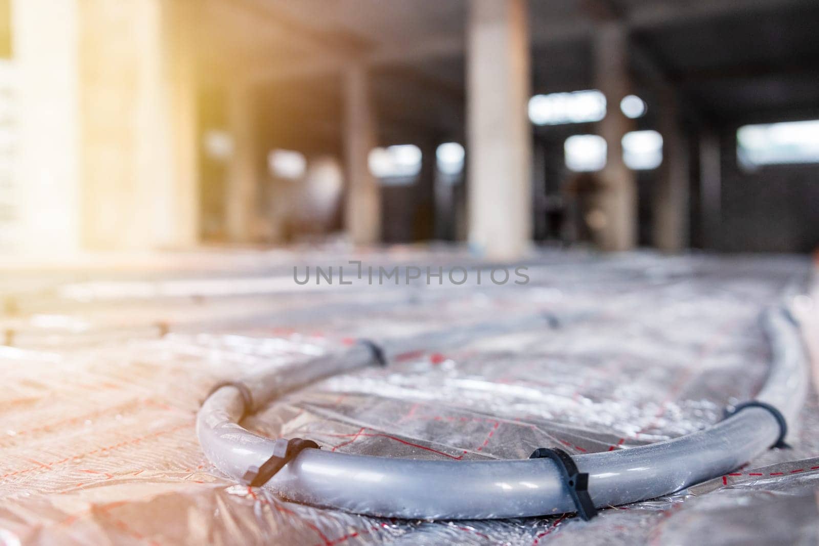 Installing Water Heating Underfloor Pipes: Enhancing Heating Systems with Underfloor Heating Technology.