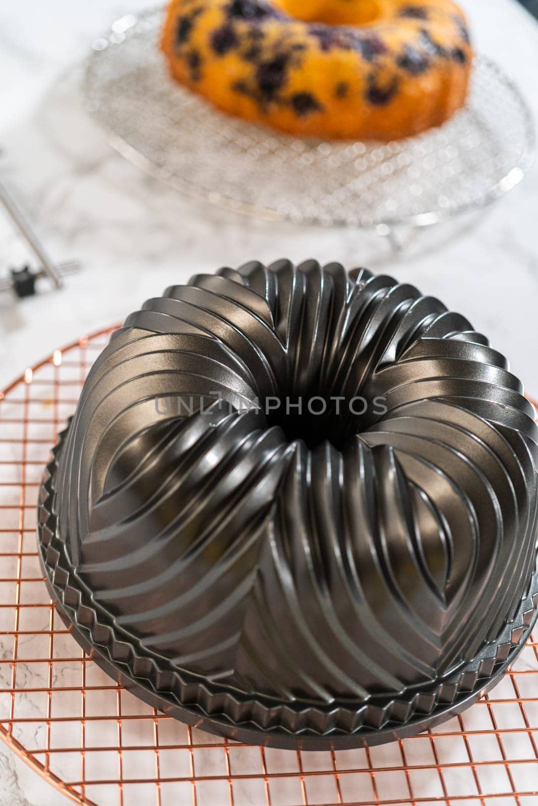 The artful extraction of the freshly baked bundt cake from its mold marks the exciting conclusion of the baking process.