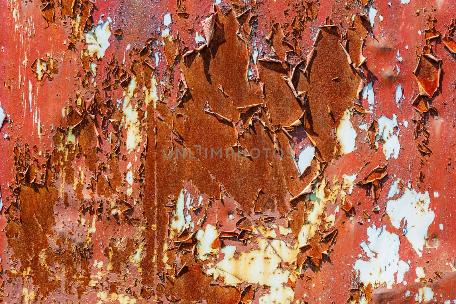 Closeup of rusty metal with peeling brown paint by z1b