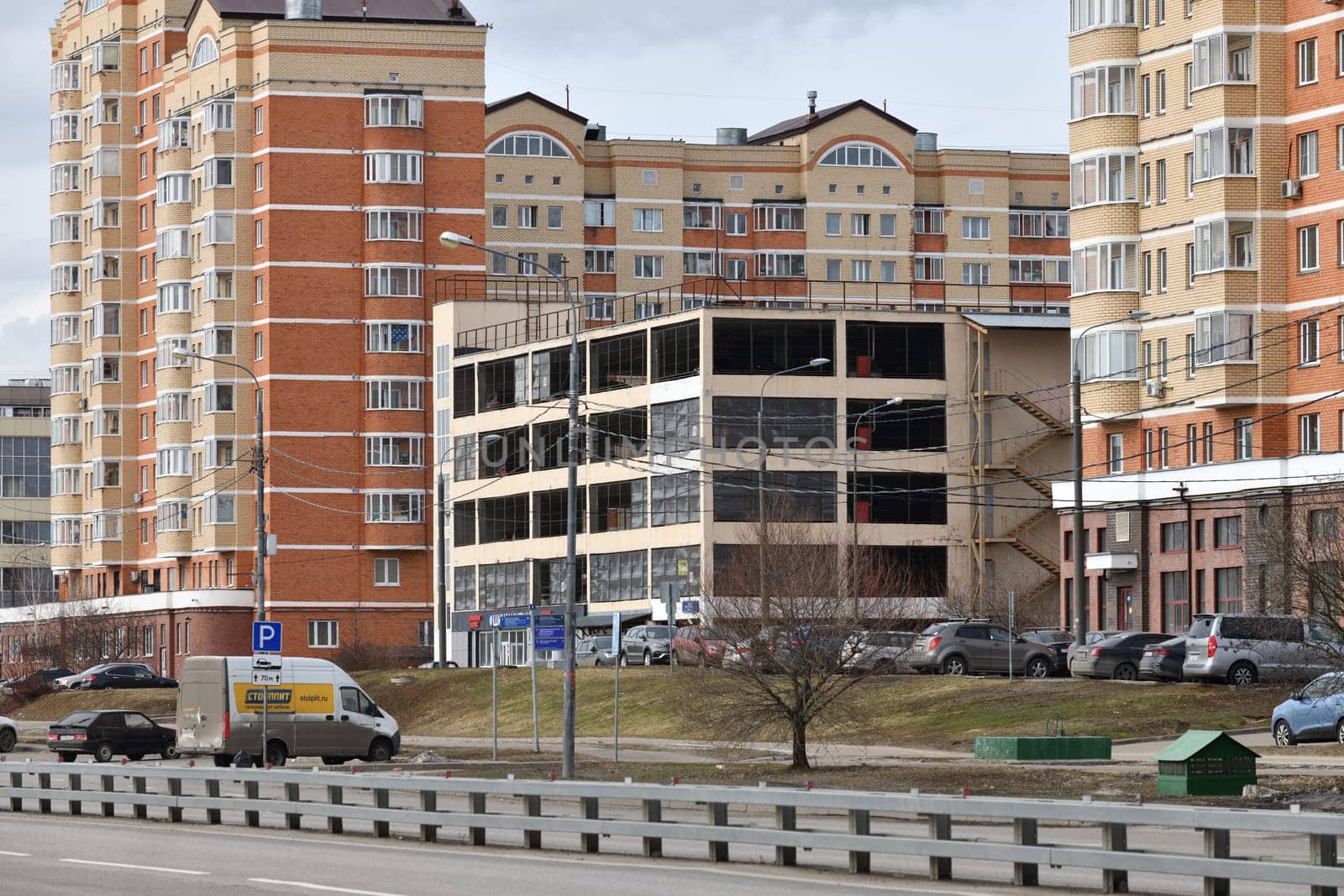 Moscow, Russia - March 26. 2024. Typical multi-storey parking garage in Zelenograd by olgavolodina