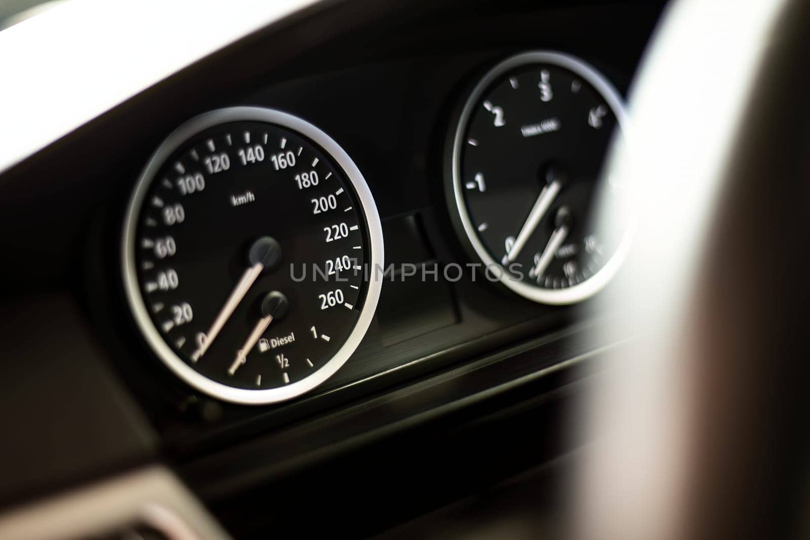 A vibrant close-up of a speedometer in a car, showcasing the thrilling power and speed of driving.