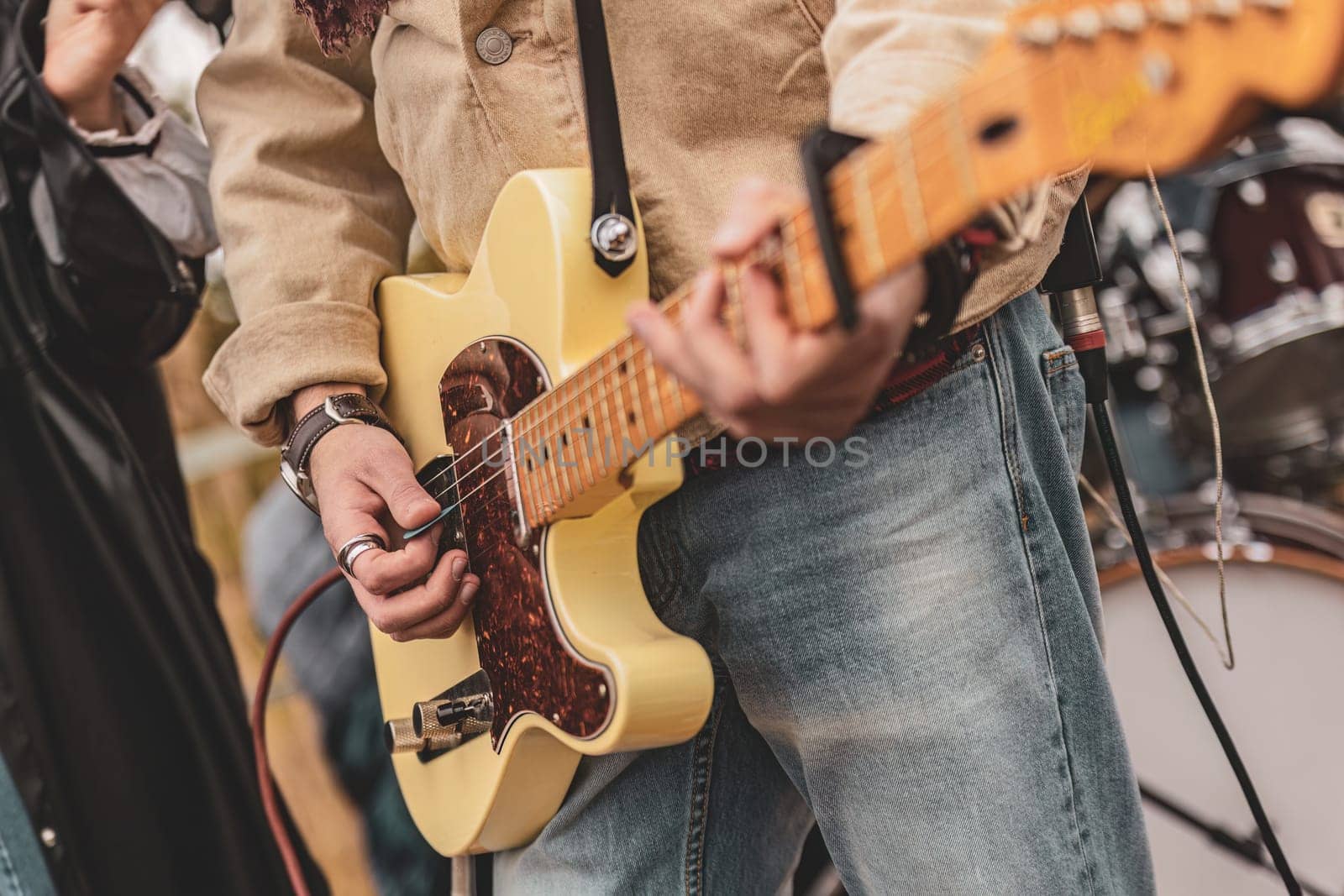 Man Holding Yellow Guitar by pippocarlot