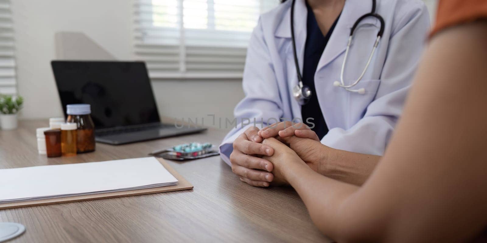 Doctor holding patient hand cheer and encourage while checking your health.