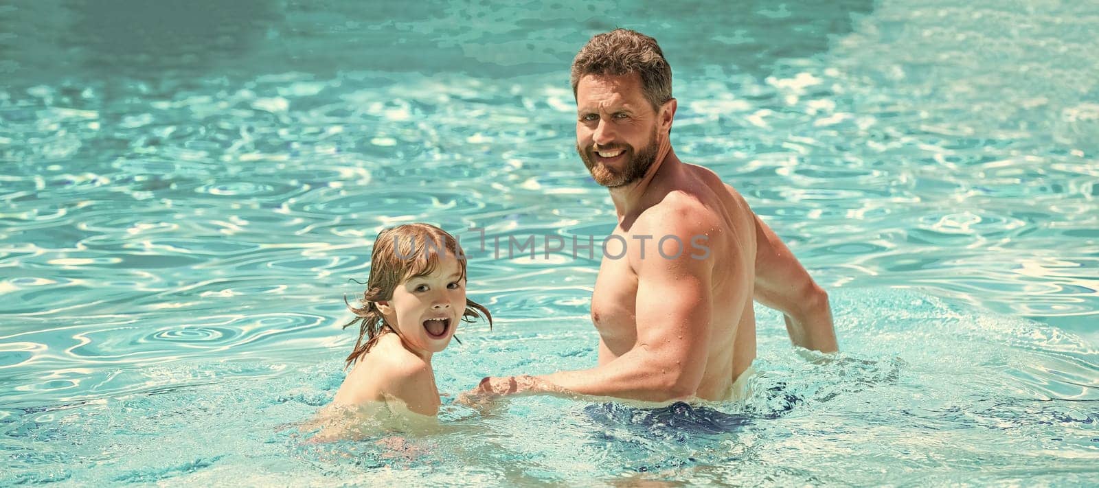 Father and son in swimming pool, banner with copy space. happy family of father and kid having fun in summer swimming pool, vacation.