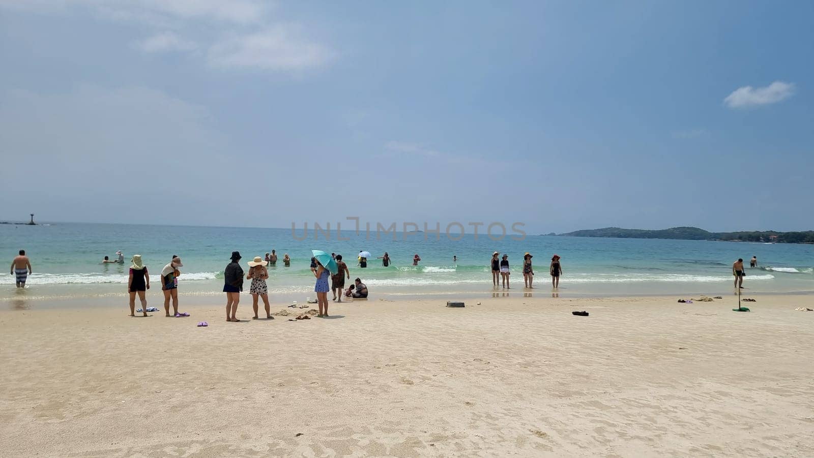 Rayong Koh Samet Thailand 27 March 2024, Chinese tourist on the beach of Koh Samet taking photos and selfies