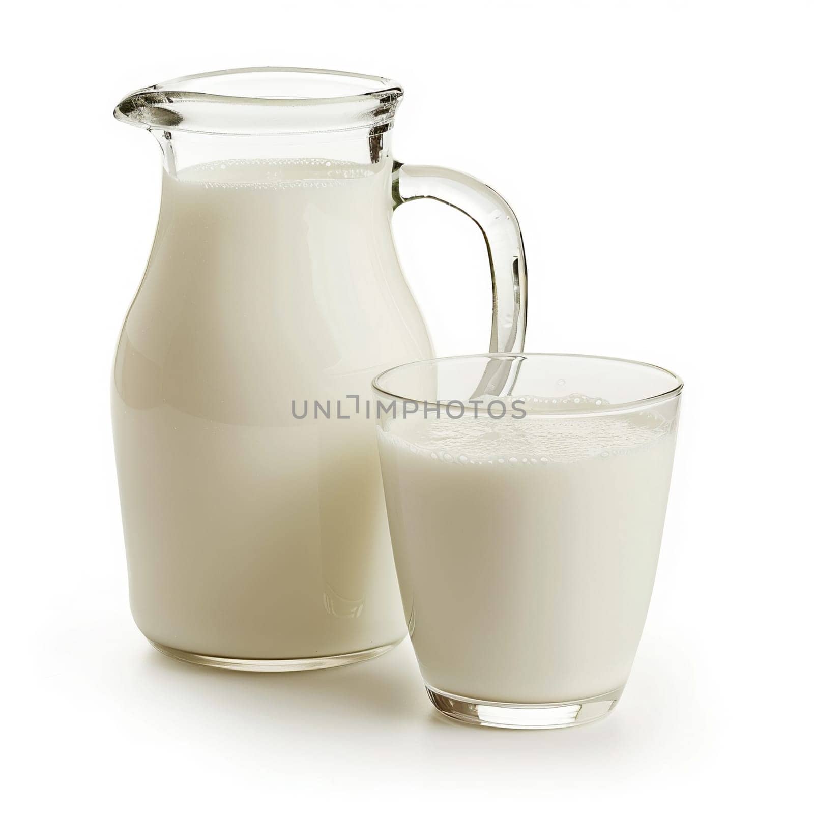 High-quality image showcasing fresh milk in a clear glass and a transparent pitcher, isolated on a white background, symbolizing health and purity.