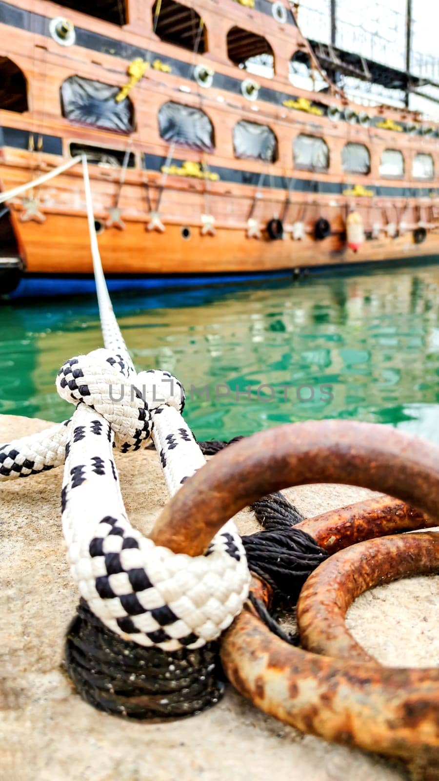 Symbol of Safety, Large Old Ship Moored at Dock with Mooring Knot, Close-Up. by Laguna781