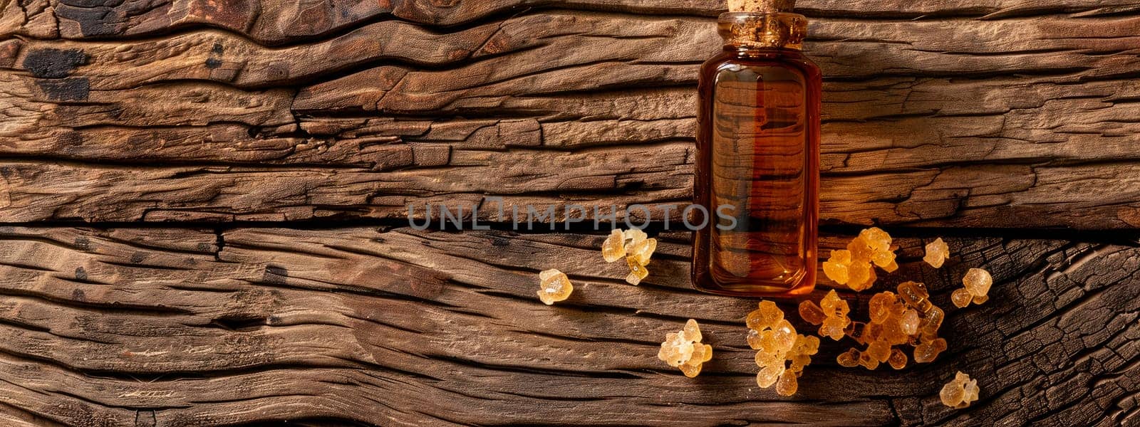 benzoin immortelle resin essential oil in a bottle. Selective focus. by yanadjana