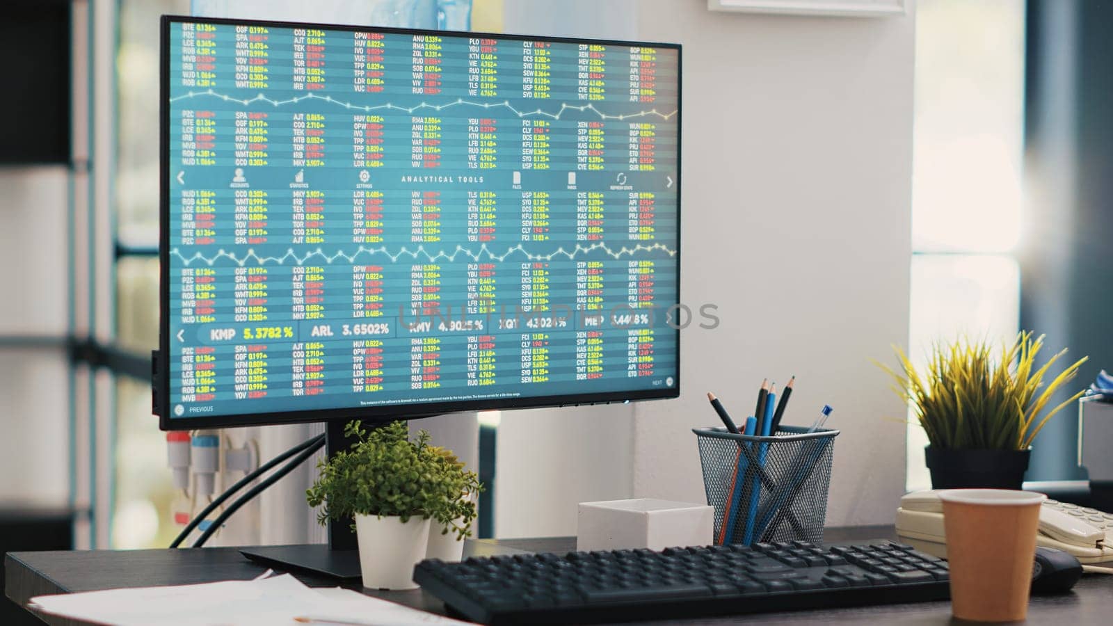 Stock trading economic analytics figures on PC screen, close up shot by DCStudio