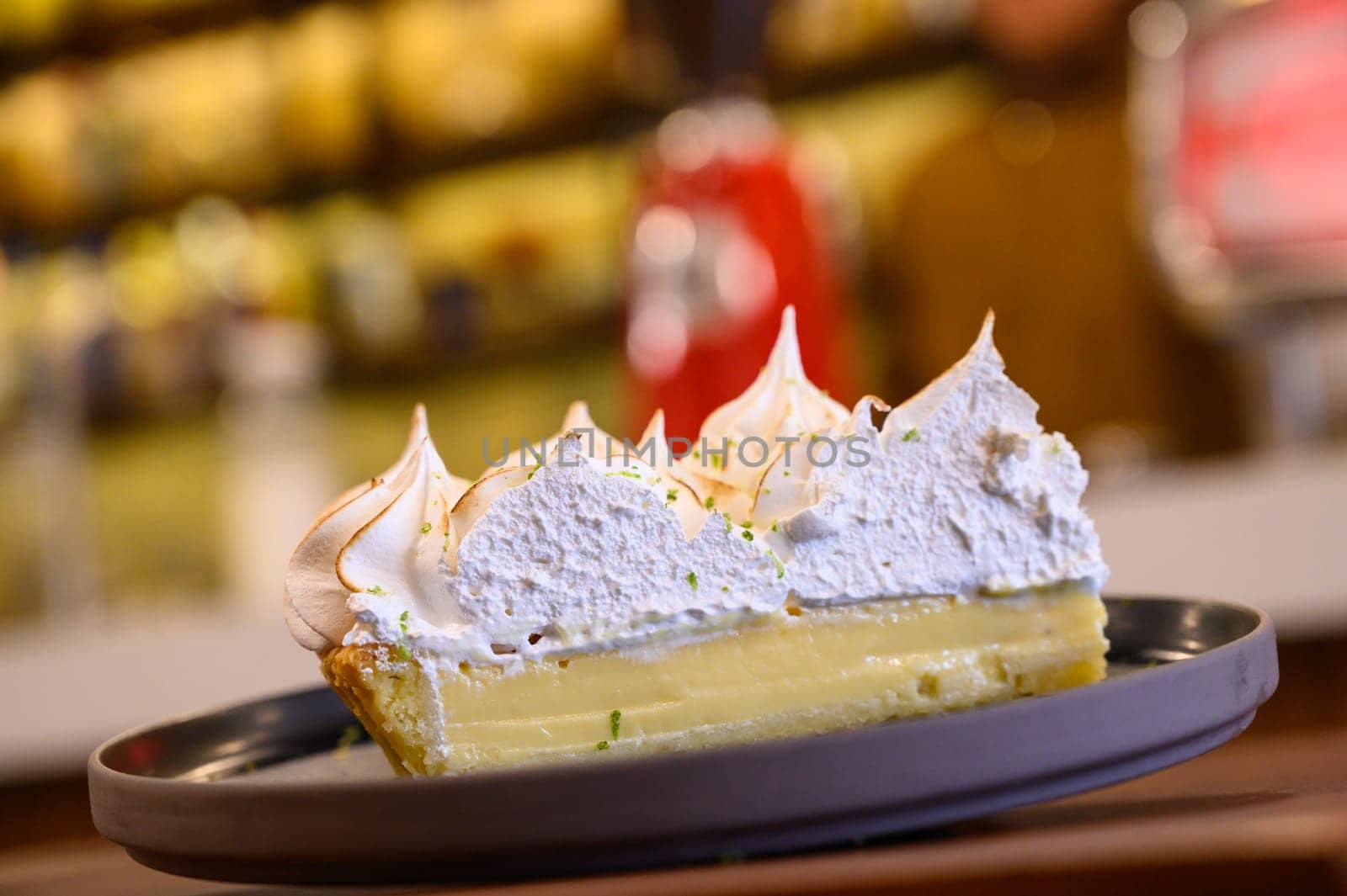 Delicious lemon meringue pie on table by Peruphotoart