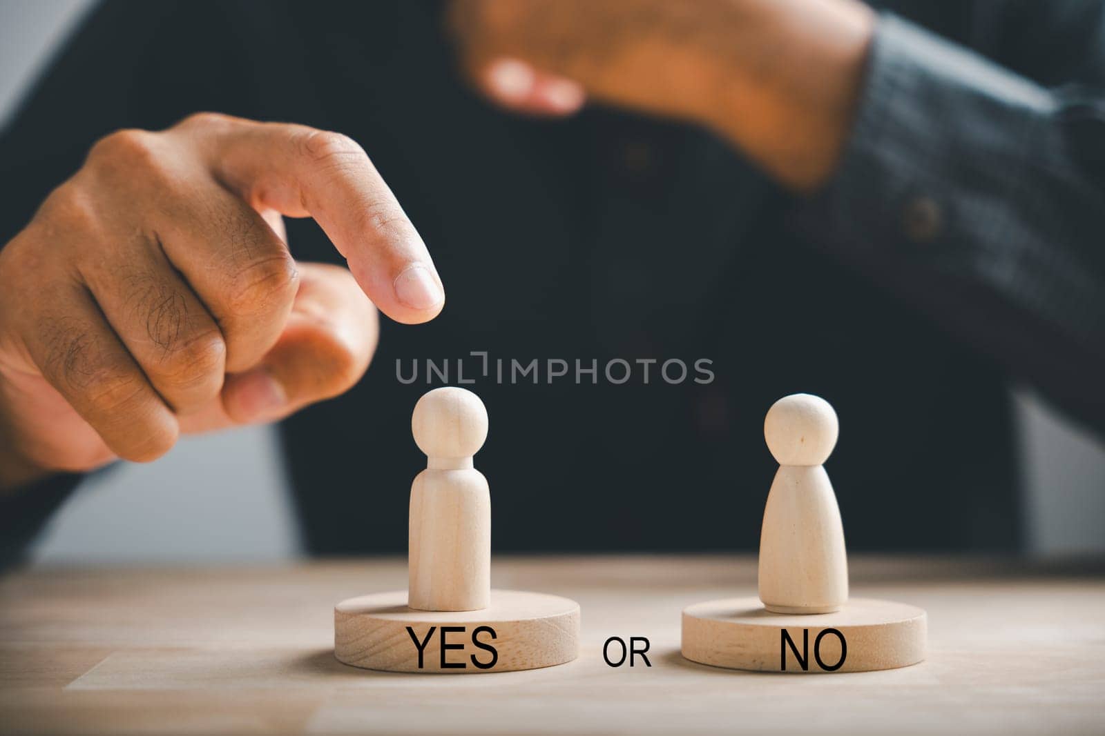 Peg dolls on wooden cube illustrate yes or no choices for business. Man making a decision with two options. Red question mark adds to the concept. Think With Yes Or No Choice. by Sorapop