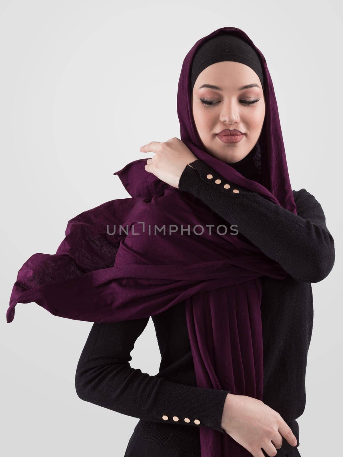 Muslim woman wearing modern stylish wear and hijab isolated on grey background. Diverse people model hijab fashion concept. High quality photo