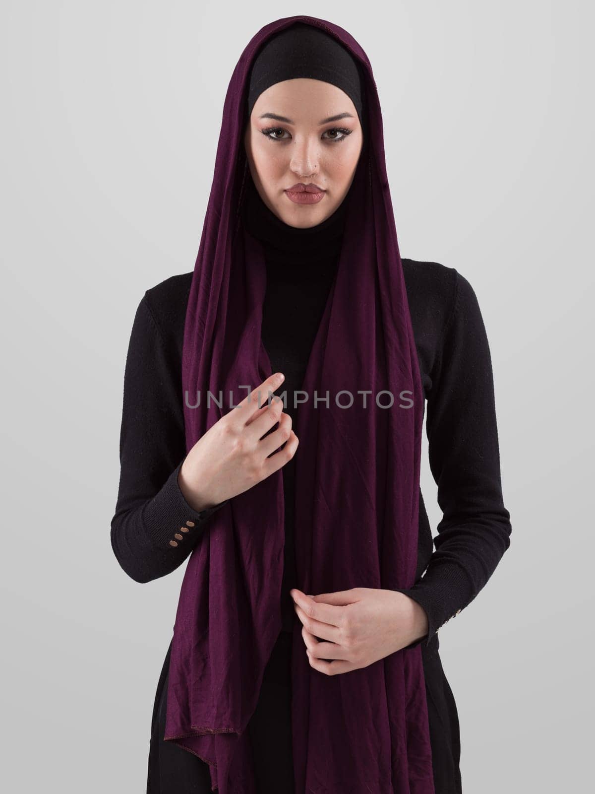 Muslim woman wearing modern stylish wear and hijab isolated on grey background. Diverse people model hijab fashion concept. by dotshock