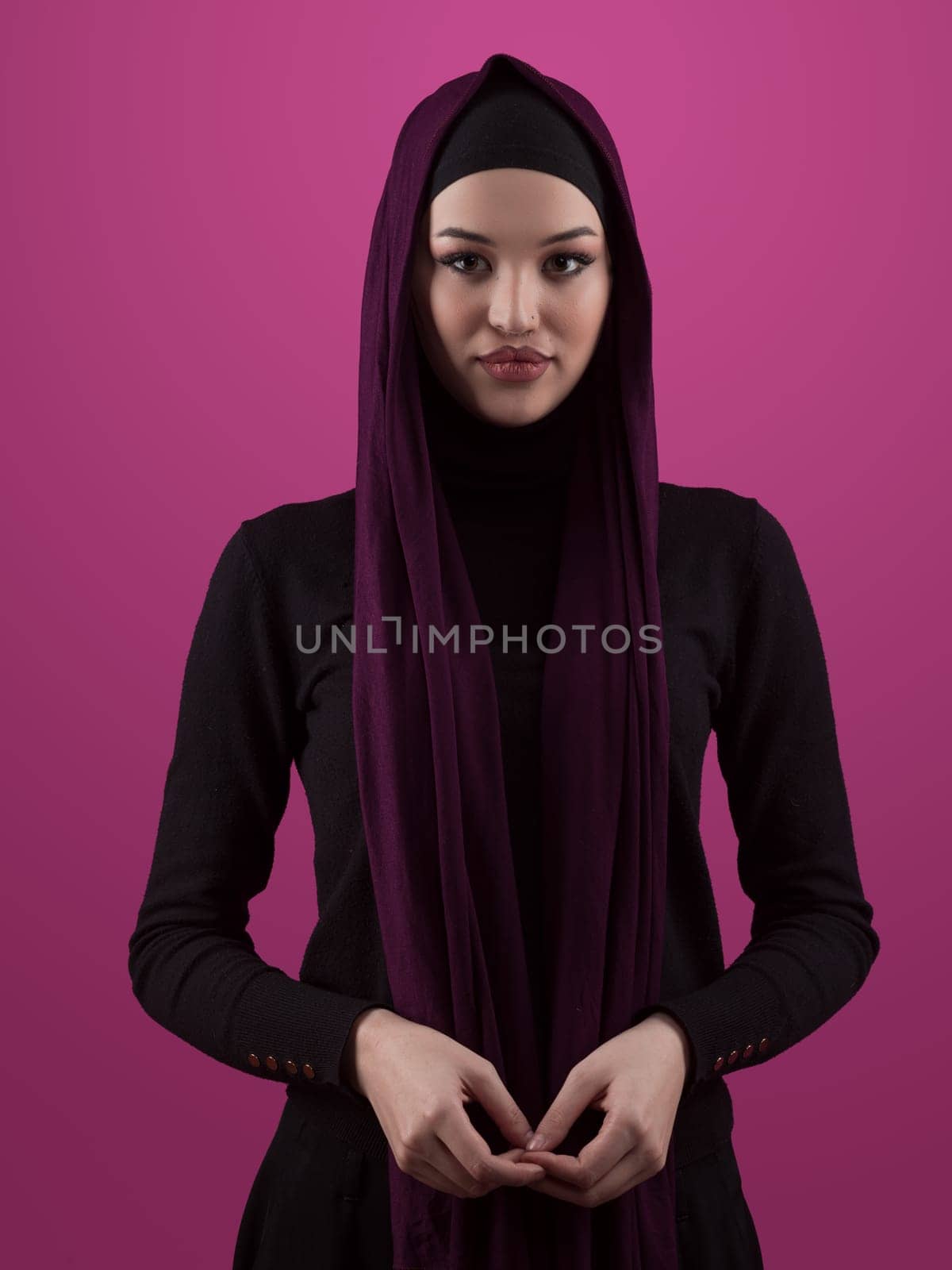 Modern Muslim woman wearing stylish hijab casual wear isolated on pink background. Diverse people model hijab fashion concept. by dotshock