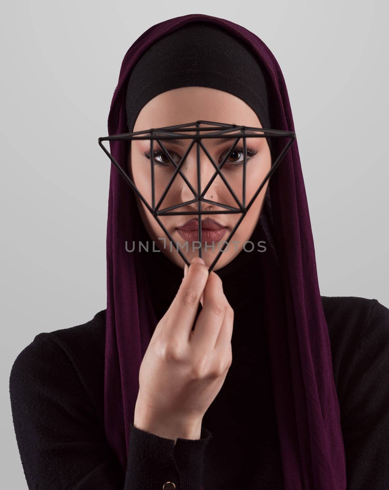 Muslim woman wearing modern stylish wear and hijab isolated on grey background. Diverse people model hijab fashion concept. Face recognition and biometric data identify face science. by dotshock