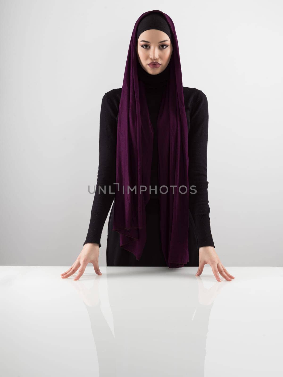 Muslim woman wearing modern stylish wear and hijab isolated on grey background. Diverse people model hijab fashion concept. by dotshock