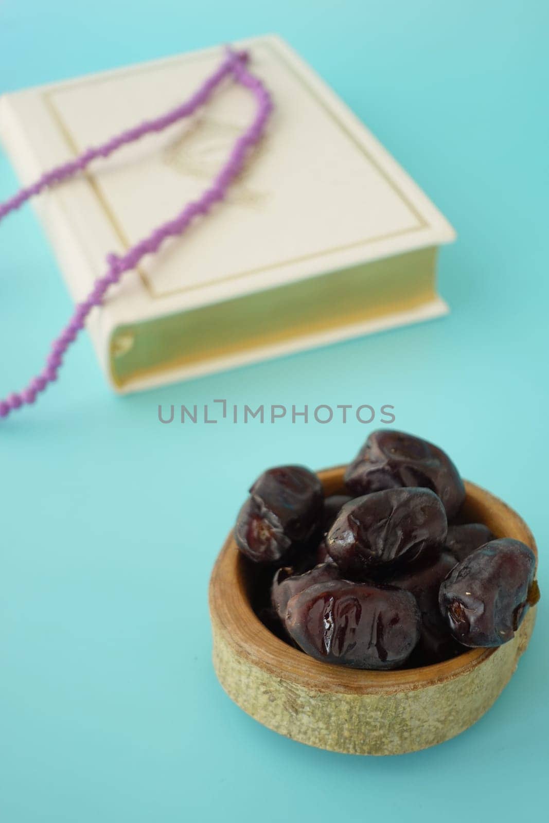 Holy book Quran and rosary on table, close up. by towfiq007