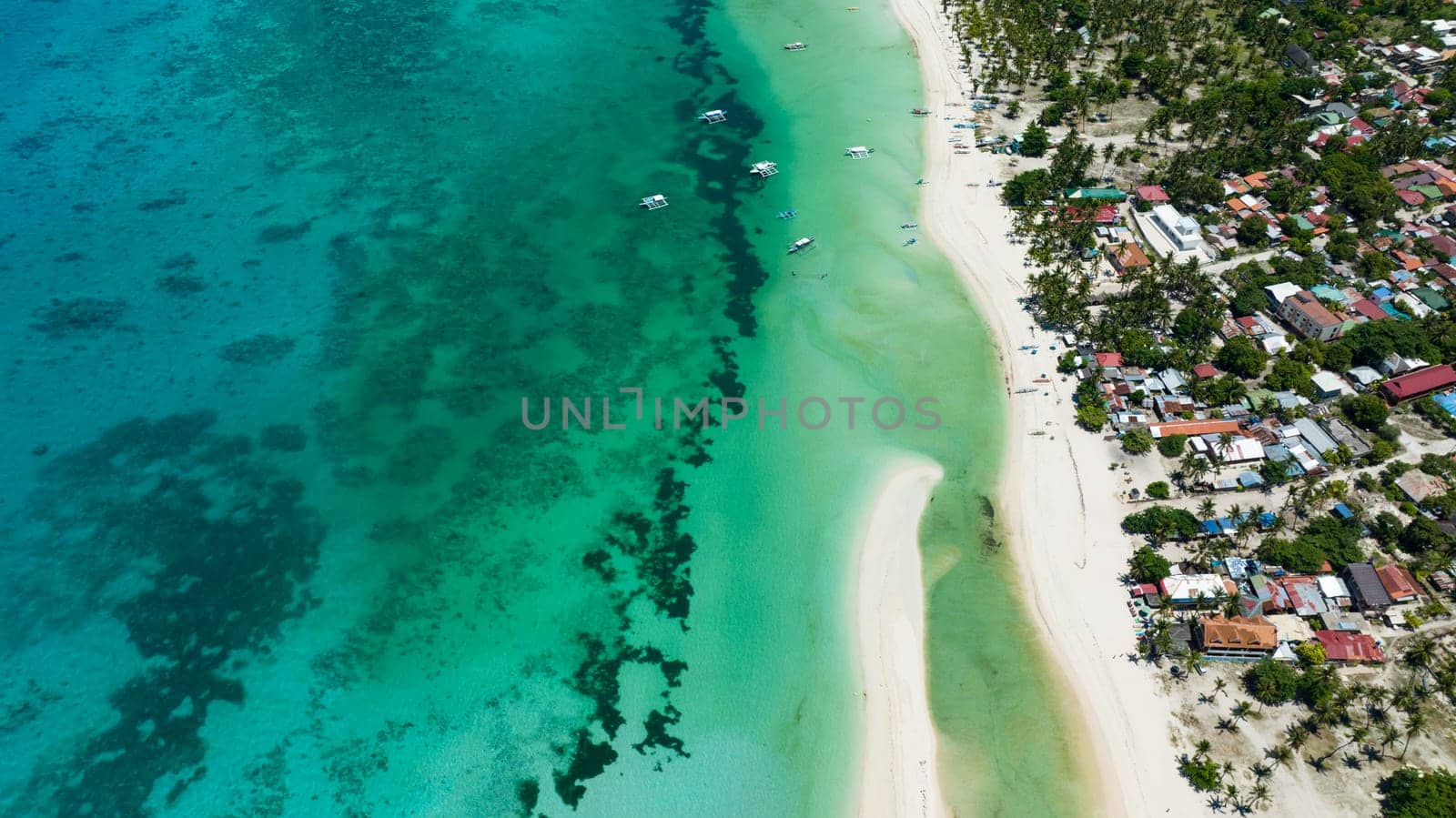 Tropical beach and clear turquoise water in the tropics. Bantayan island, Philippines.