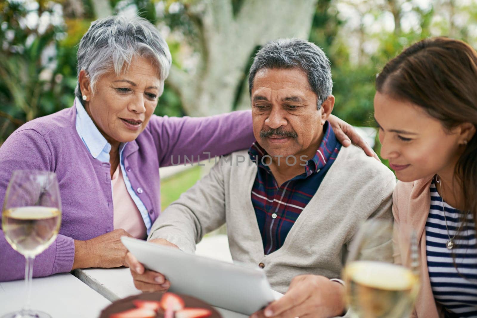 Family, senior and couple, outdoor and anniversary with old man reading letter, romance and love for wife. Garden, daughter and mother with smile, listening and happy for celebration and home.