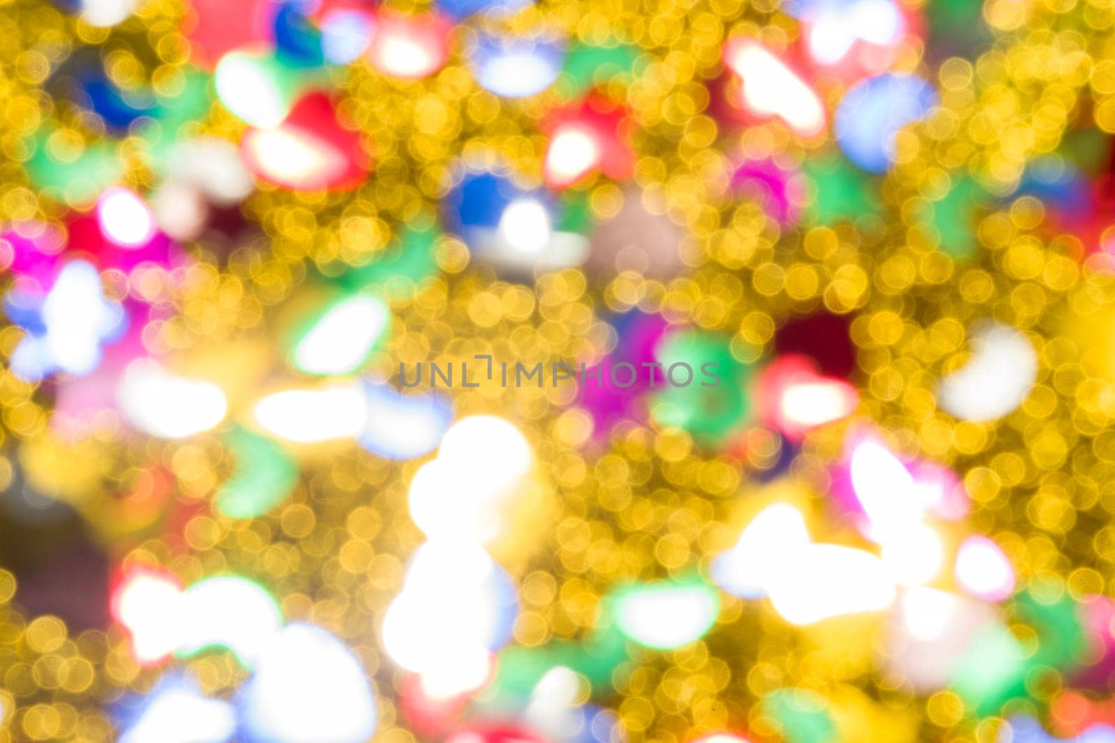 Abstract golden color lights chrismas background. de-focused by zartarn