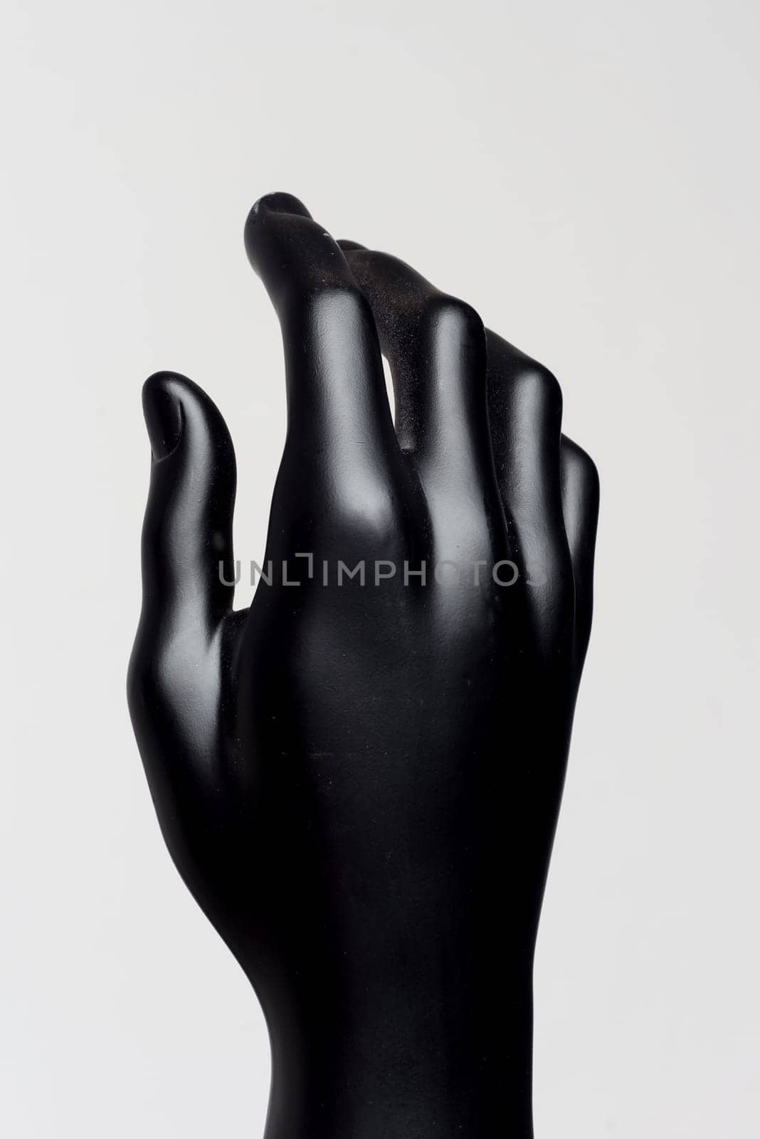 Hand of male black mannequin on a white background by zartarn