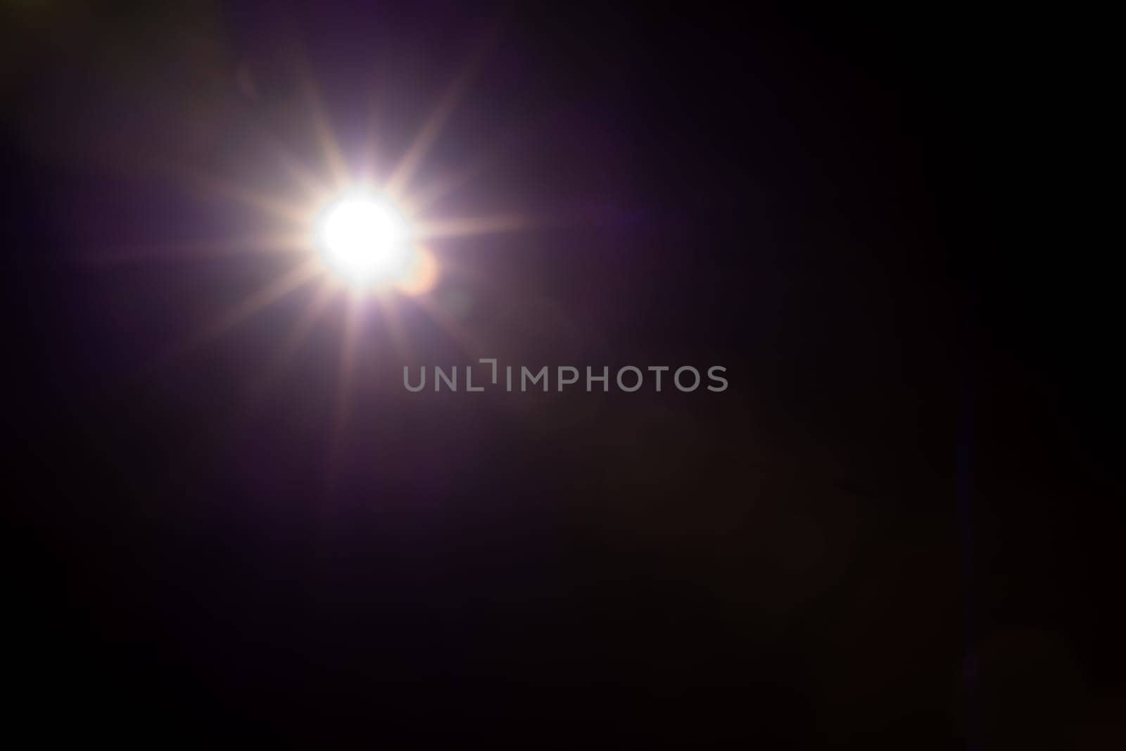 Abstract Natural Sun flare on the black.