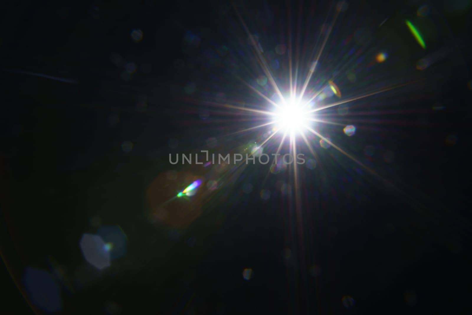 Abstract imitation sun starlight distant galaxy on a black background. -image