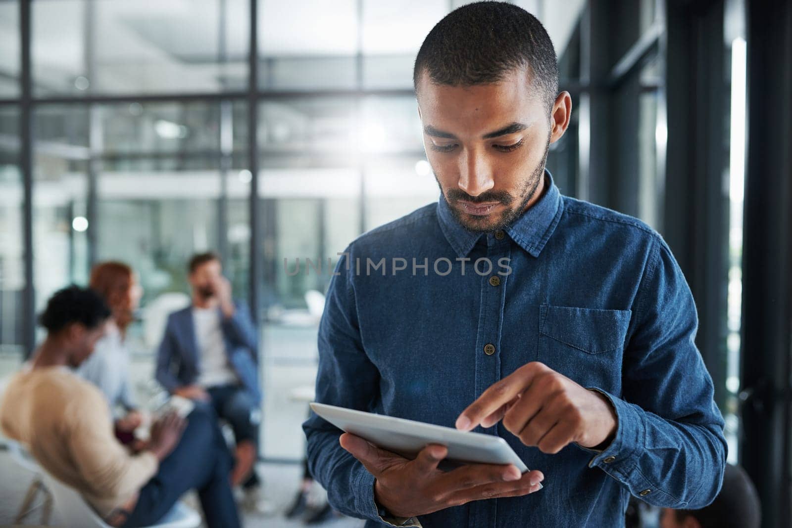 Businessman, reading and digital tablet in office or serious for creative research, schedule and planning. Entrepreneur, employee or pride with online article for project, communication or web search.