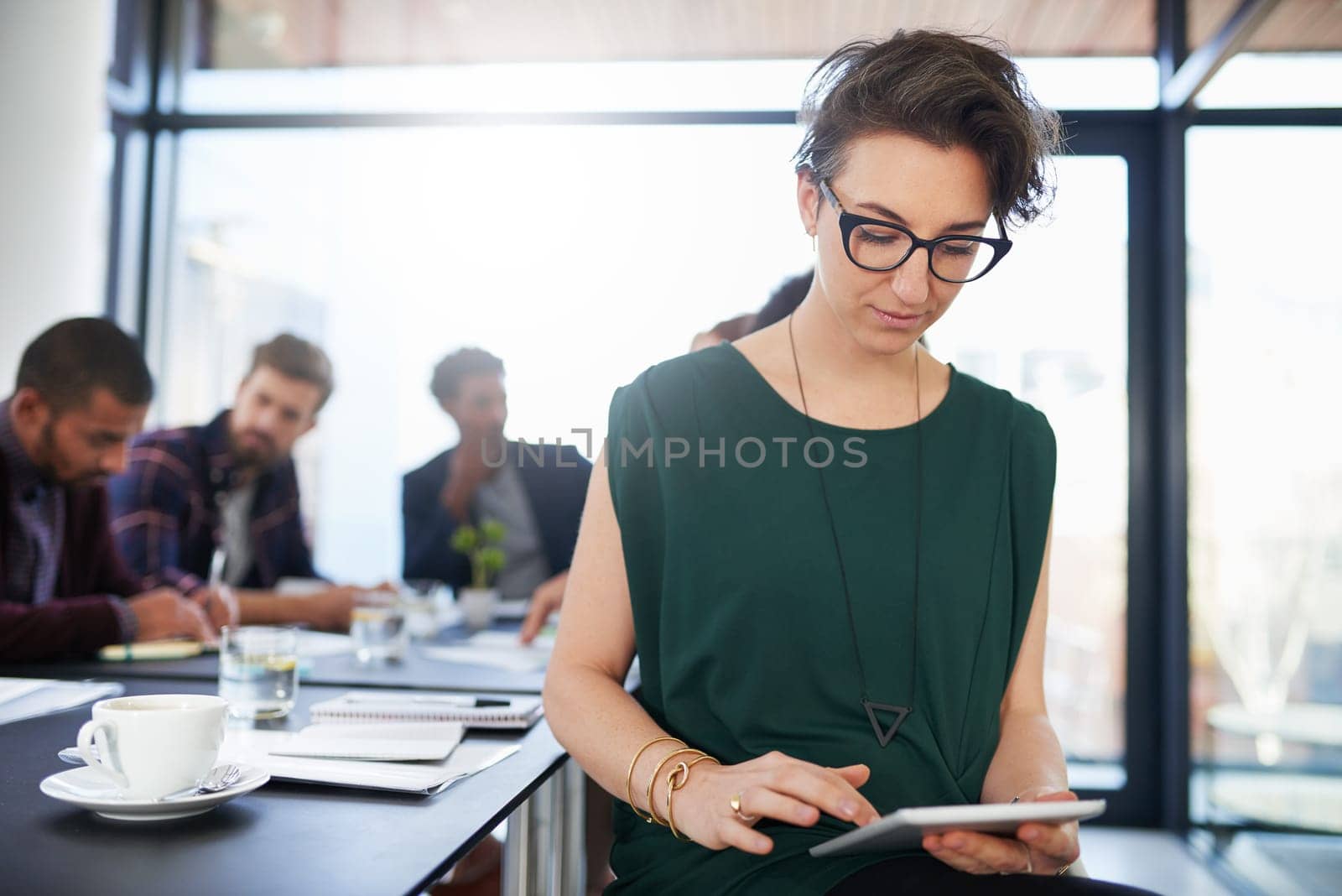 Business, woman and tablet in boardroom with reading for creative research, schedule check or planning. Entrepreneur, employee and glasses with online article for project, communication or web search by YuriArcurs
