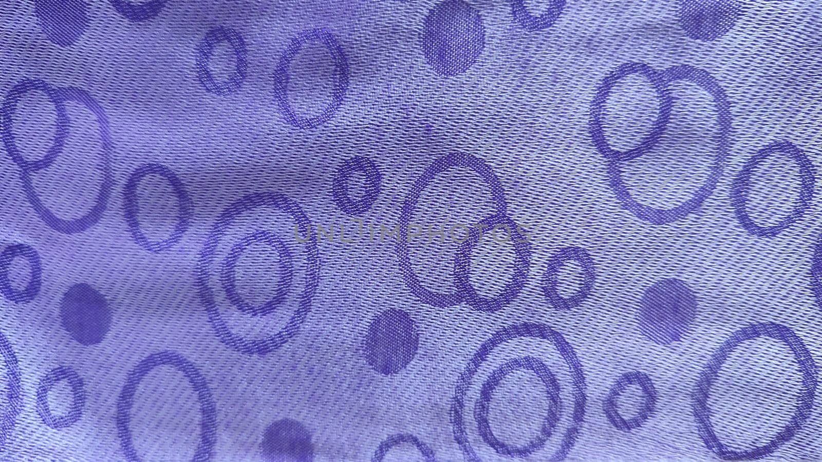purple background with circles, abstraction on fabric, silk. High quality photo