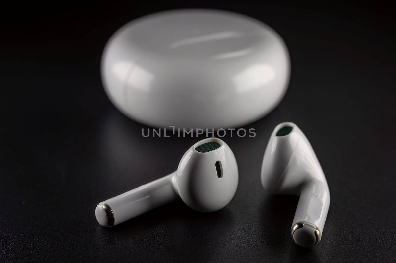 ROSTOV-ON-DON, RUSSIA - APRIL 28, 2018: Apple AirPods wireless Bluetooth headphones and charging case for Apple iPhone. New Apple Earpods Airpods in box. by zokov