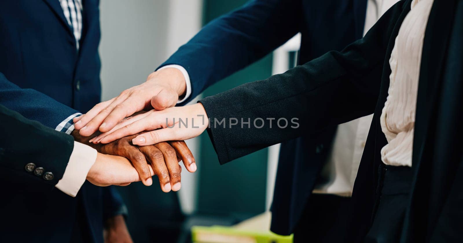 Entrepreneurs and employees unite in a modern office, forming a circle and holding hands in a symbolic act of teamwork and unity. diversity and communication is an inspiring example of togetherness.