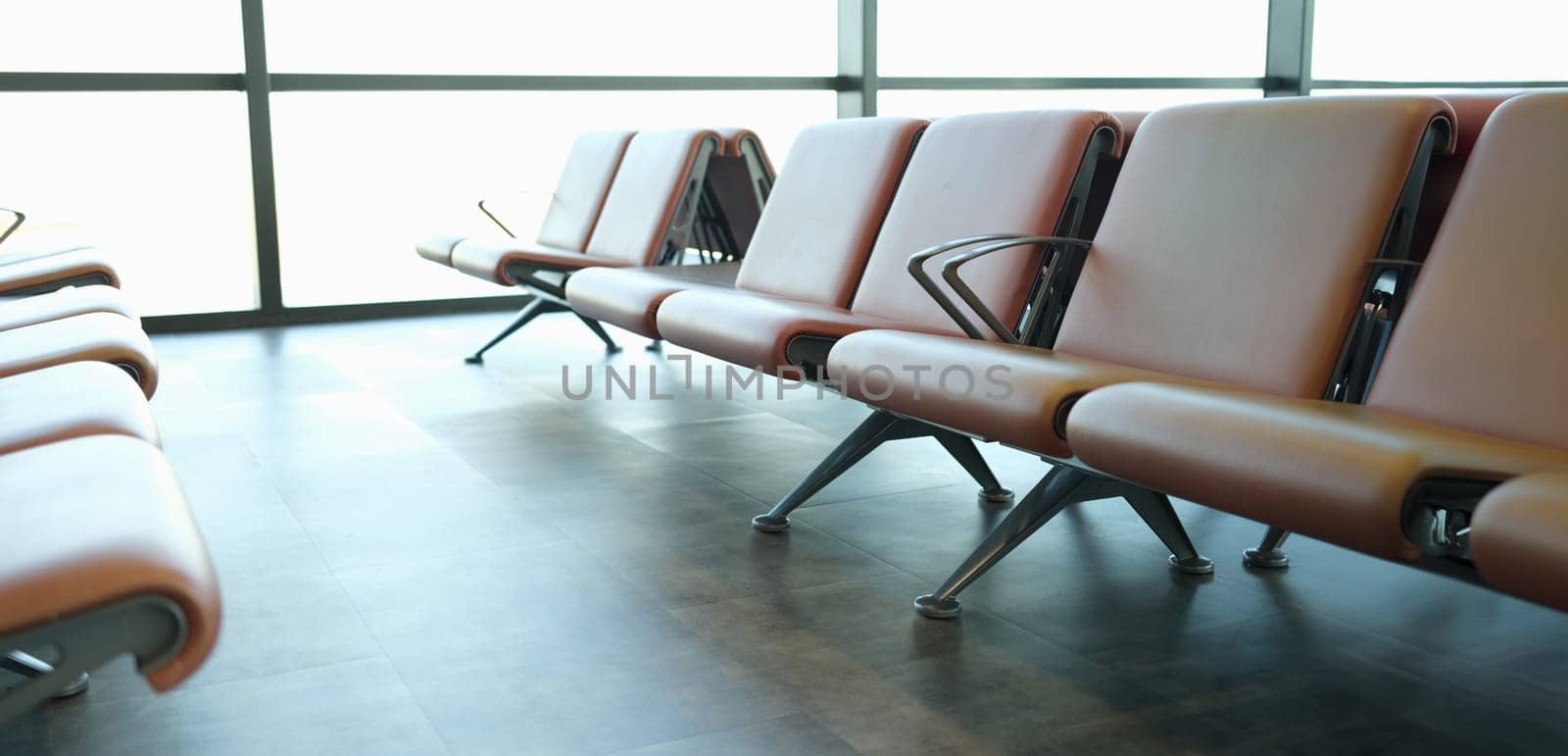Location in airport terminal. Leather light brown armchairs at station station by kuprevich