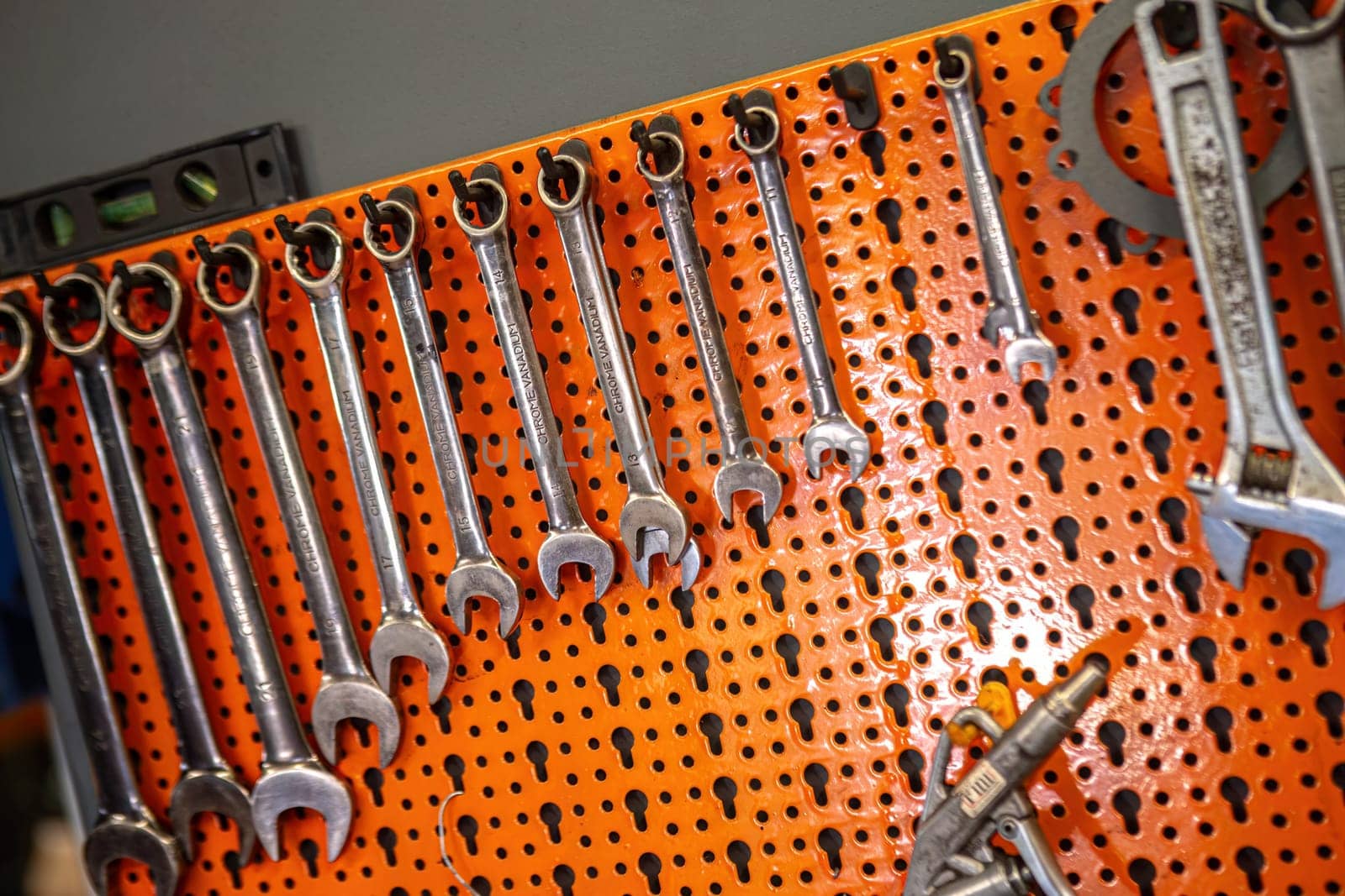 Milan, Italy 9 April 2024: Close-up view of keys hanging in a workshop setting.