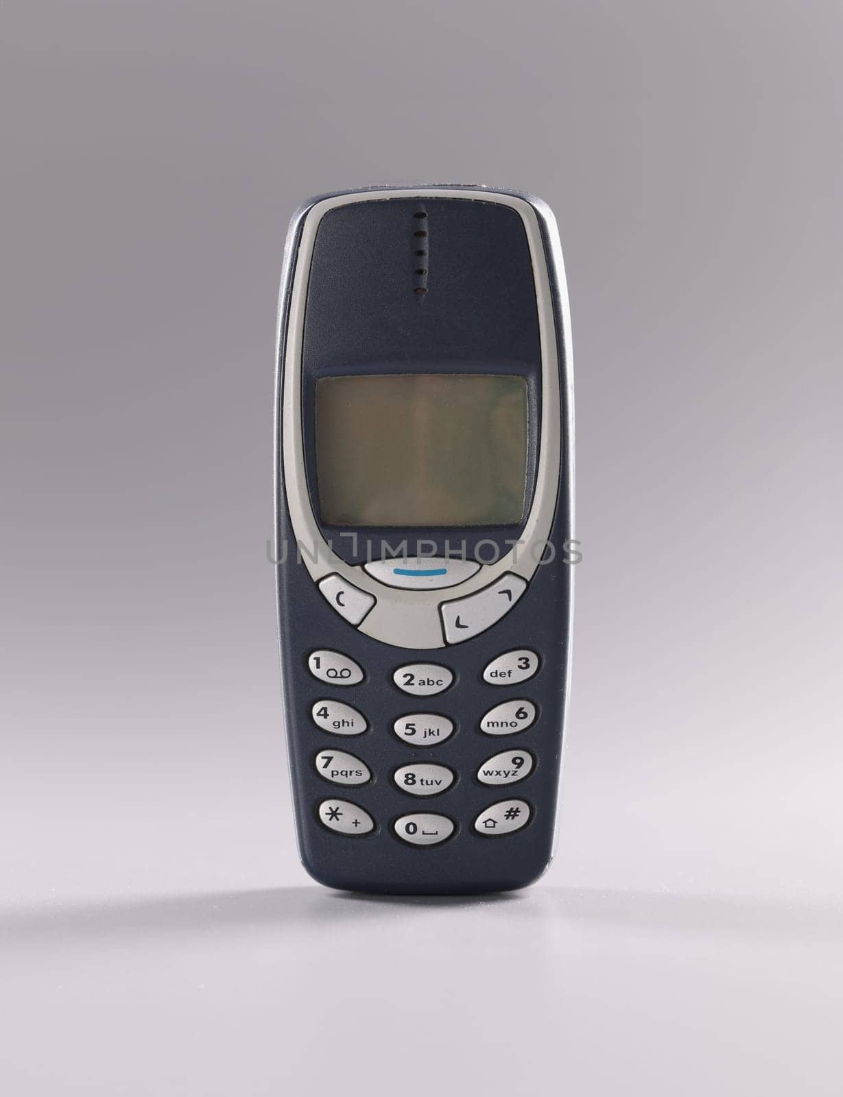 Georgia Tbilisi June 23, 2022: Original Nokia 3310 on gray background by kuprevich